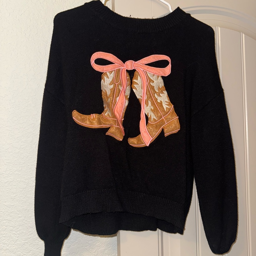 Black Sweater with Boot Design